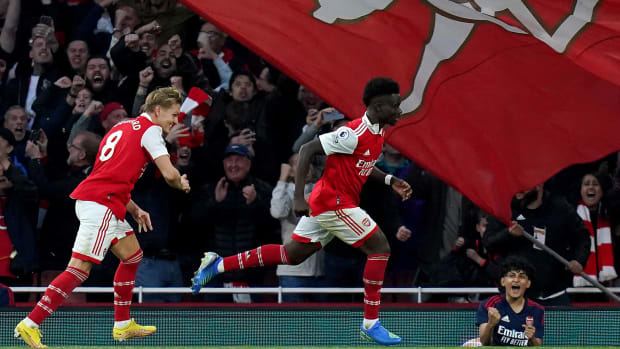 Bukayo Saka pictured (center) after scoring for Arsenal in a 3-2 win over Liverpool in October 2022